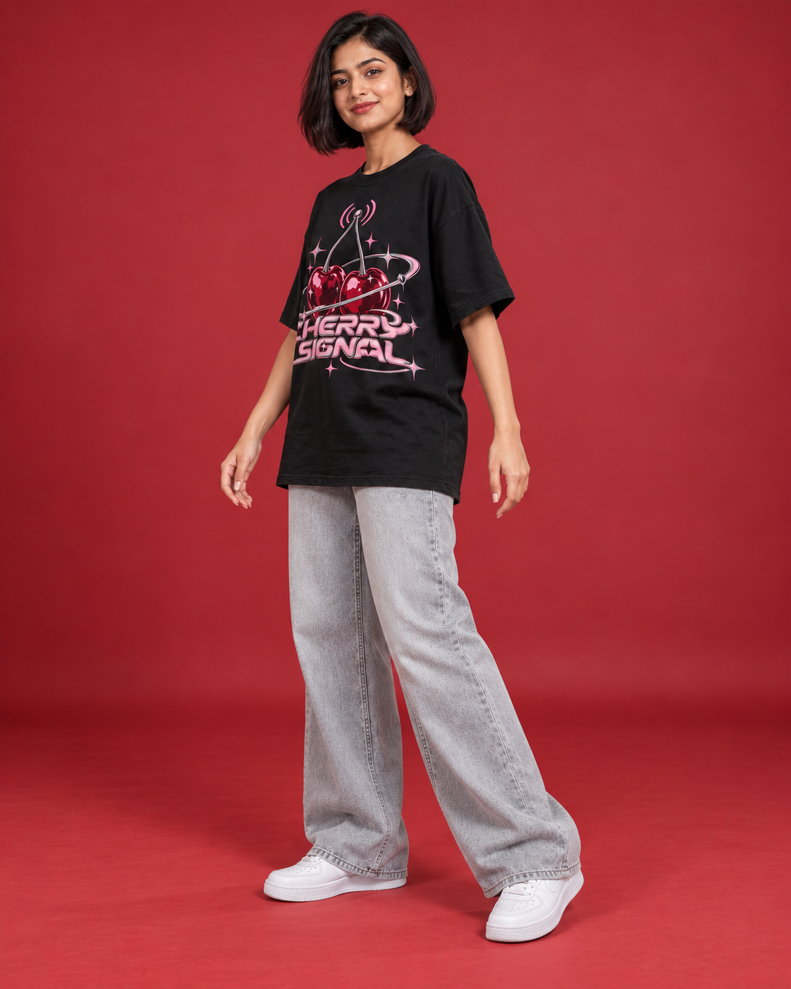 CHERRY SIGNAL women's black oversized tee three-quarter side