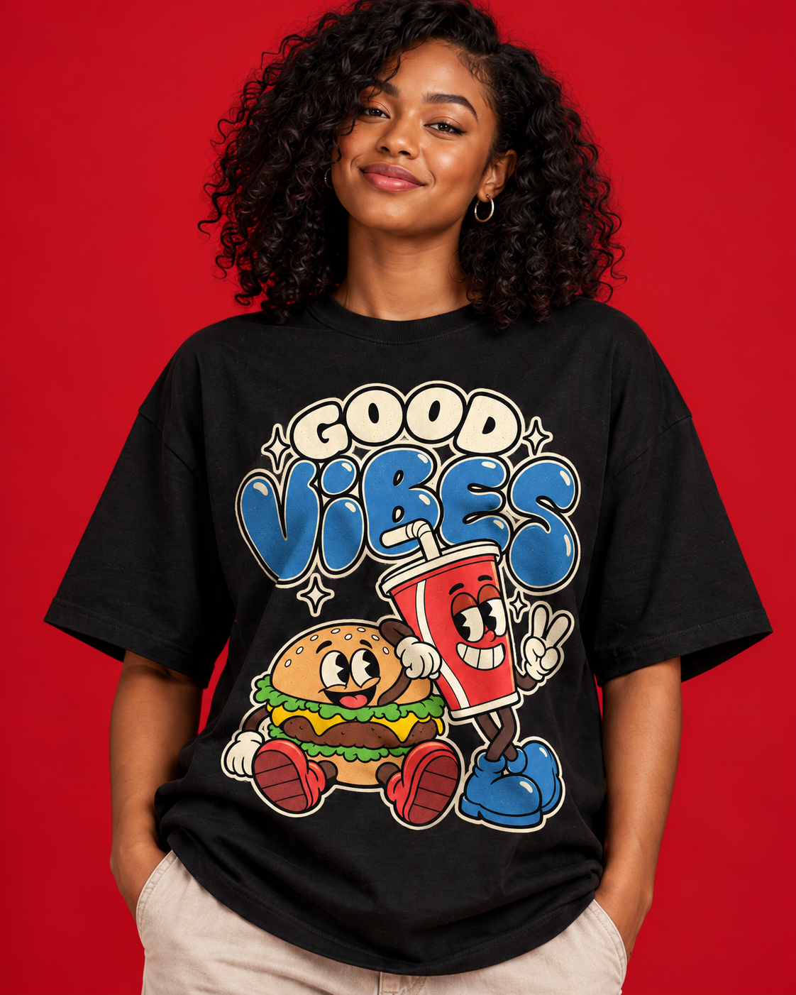 Good Vibes women's black oversized tee close-up cream blue lettering burger and red drink retro print cotton folds