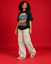 Good Vibes women's black oversized tee front three-quarter view retro burger cup illustration