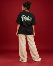 NIVANT Marathi निवांत black tee mint peach back typography