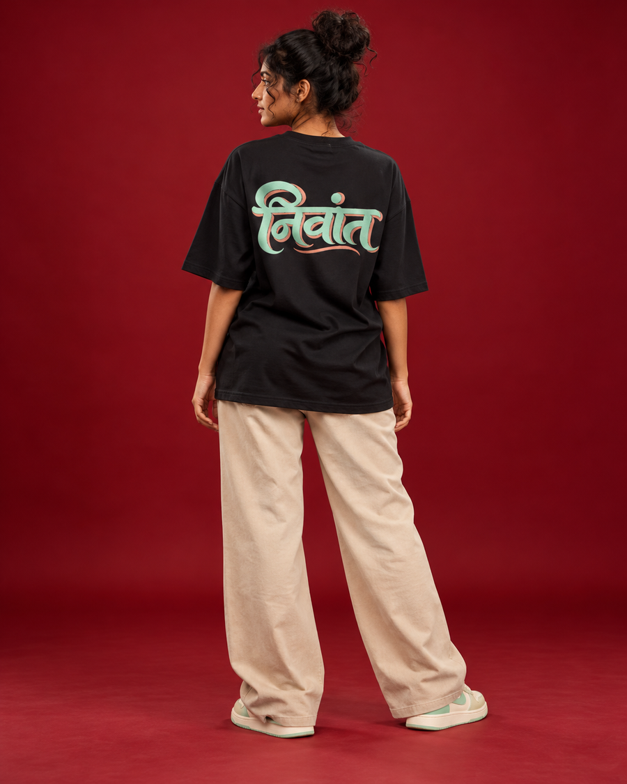 NIVANT Marathi निवांत black tee mint peach back typography