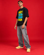Party Tera Bhai Dega black oversized tee front three-quarter view yellow cyan typography