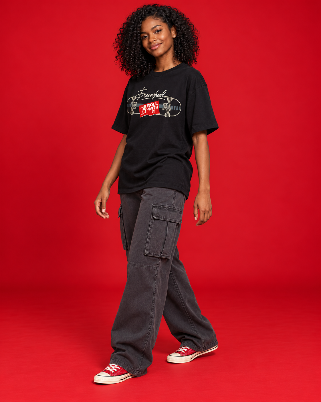 Roll With It women's black tee compact front skateboard graphic three-quarter side view