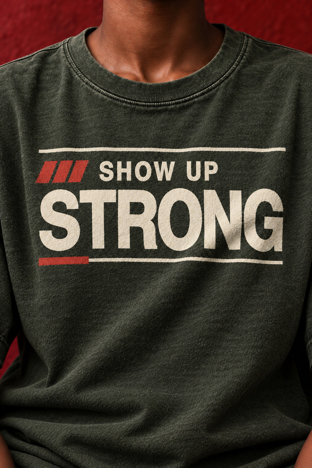 Close-up of SHOW UP STRONG ink following a natural cotton fold