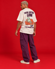 Social Battery Low off-white oversized T-shirt rear three-quarter view humorous battery sofa back print
