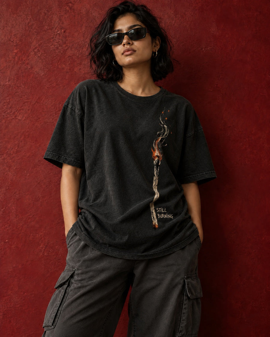 Front view of Still Burning oversized tee with print following fabric folds