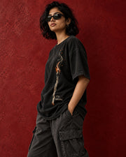 Side view of Still Burning oversized tee with natural print drape