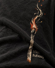 Close-up of Still Burning print bending through cotton fold