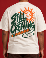 STILL CREATING green orange back artwork close-up