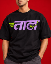TAAL black oversized T-shirt chest print close-up lilac lettering lime vinyl record detail