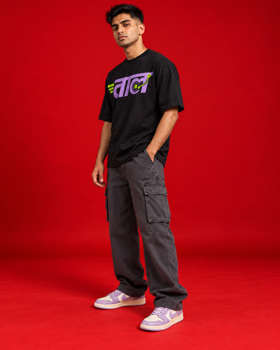 TAAL black oversized T-shirt three quarter side view with naturally curved Marathi print